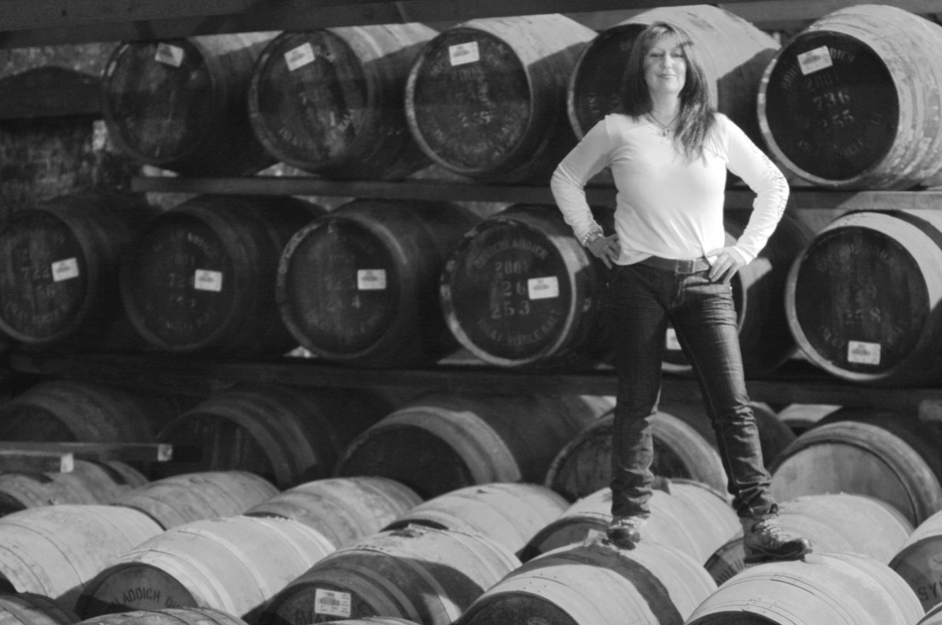 Image of woman standing on barrels