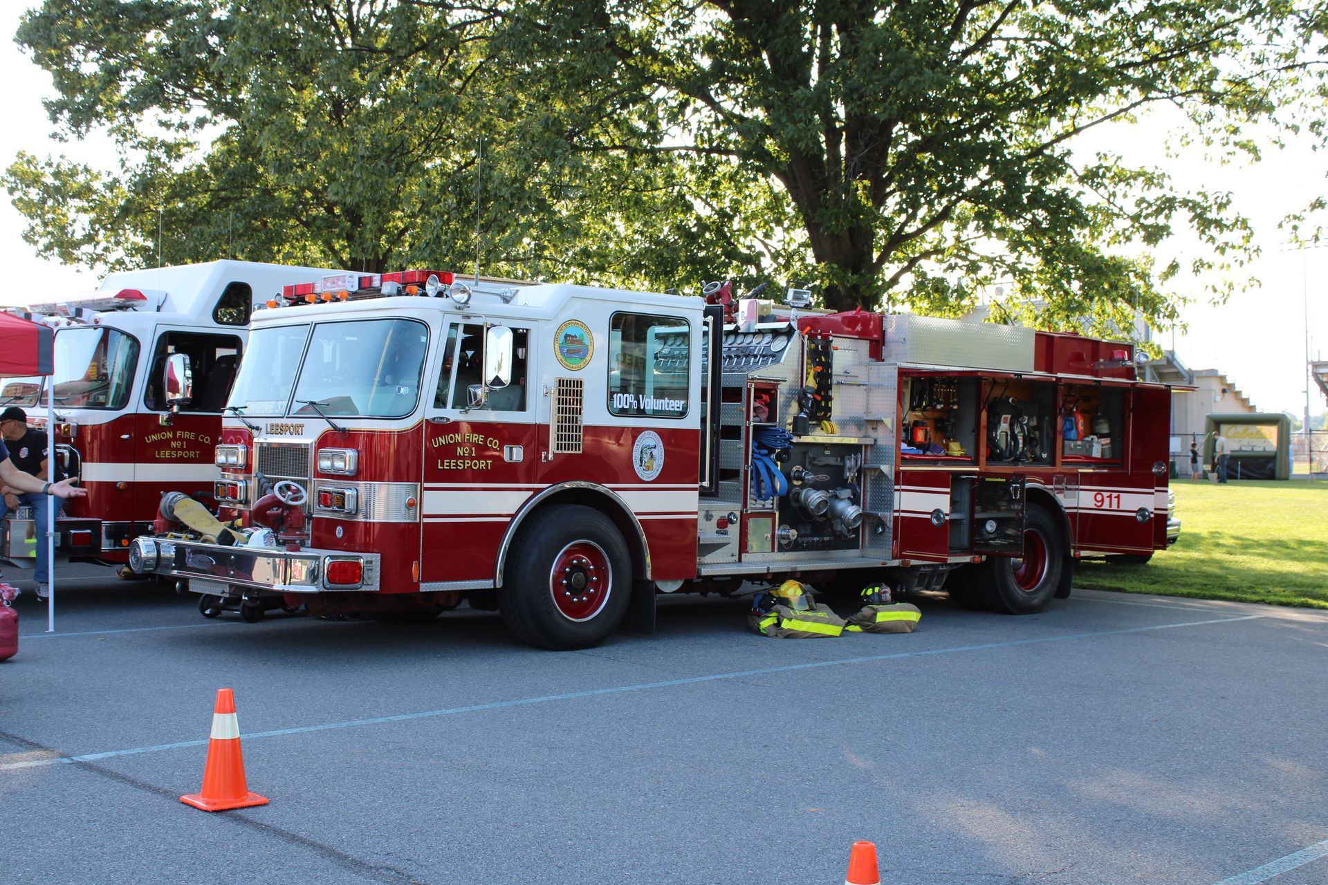 Two fire trucks are parked on the side of the road