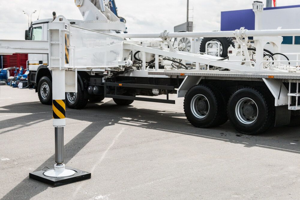 A White Truck With a Crane Attached to It is Parked in a Parking Lot — BS Crane Truck and Trailer Hire In Tewantin, QLD