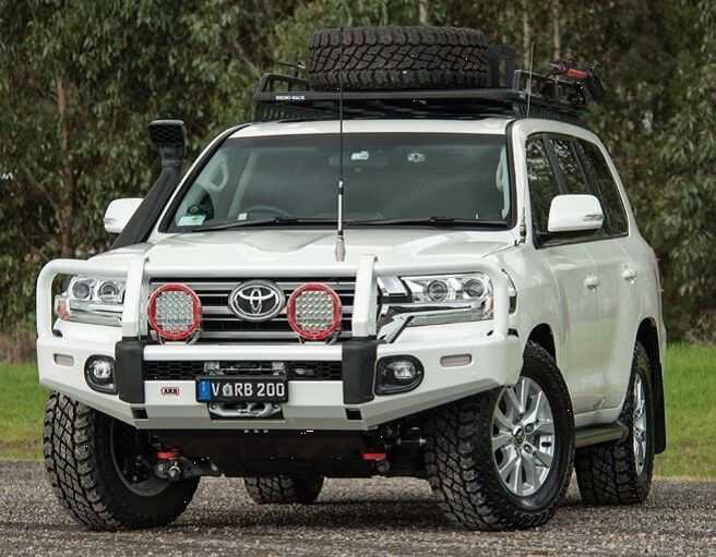 A White Toyota Land Cruiser With A Roof Rack On Top Of It — Emerald 4x4 in Emerald, QLD