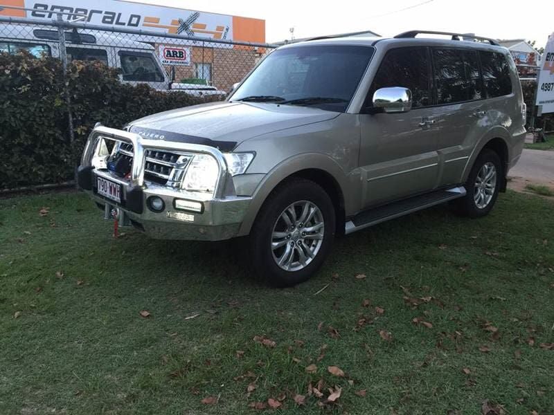 A Silver Suv Is Parked In Front Of A Building That Says Emerald — Emerald 4x4 in Emerald, QLD