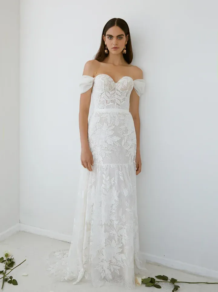 Intricate lacey wedding gown with cap sleeves