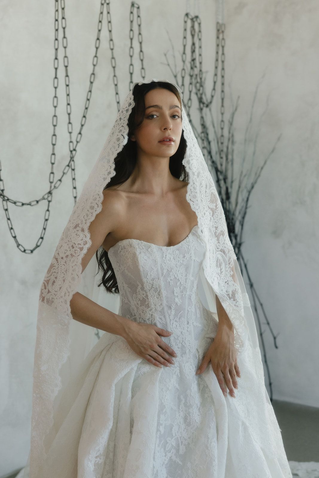 Close-up detail of an exclusive designer wedding dress shoulder with intricate beading