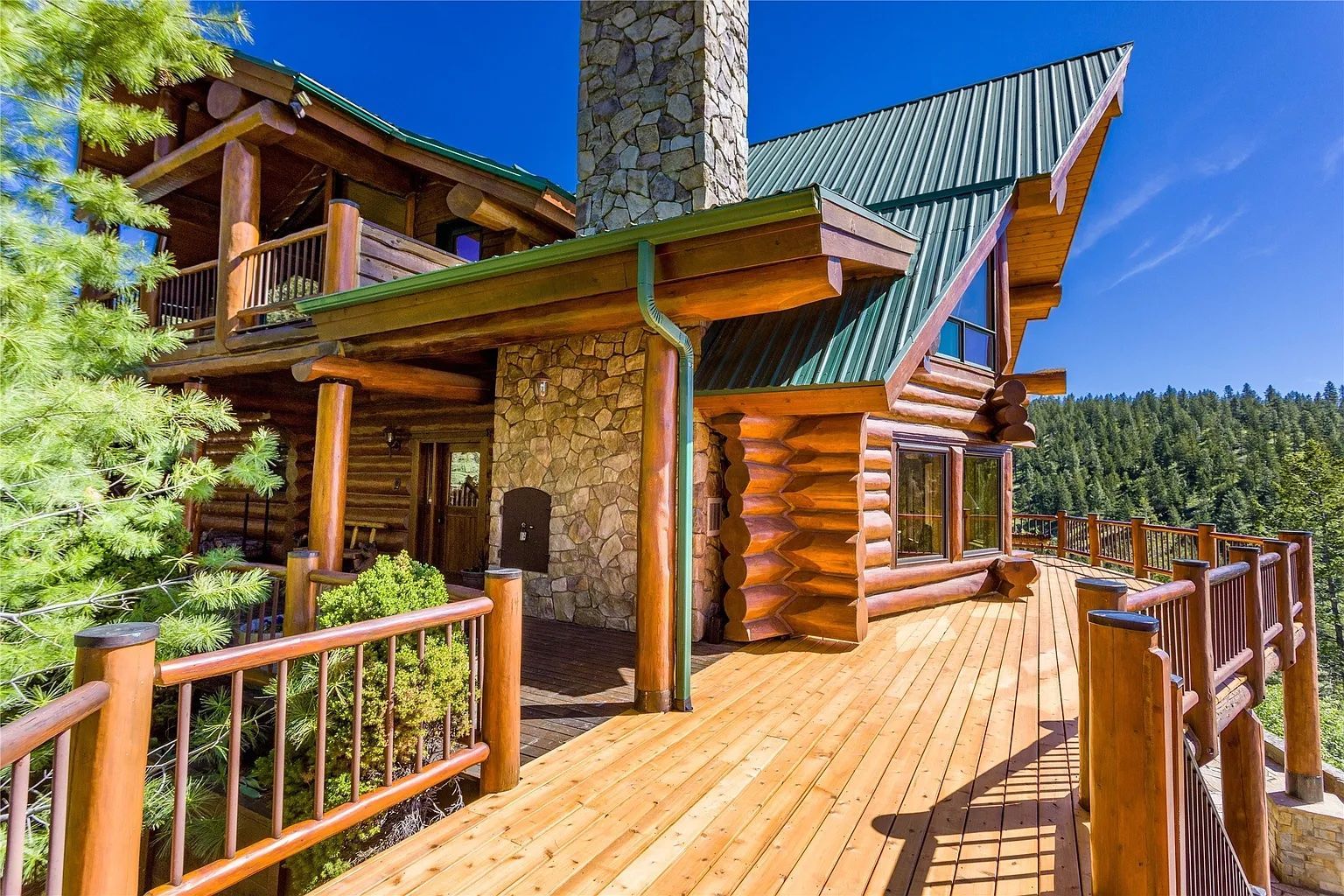 The Ridge lodge exterior with wraparound deck, offering scenic mountain views for vacation rental guests.