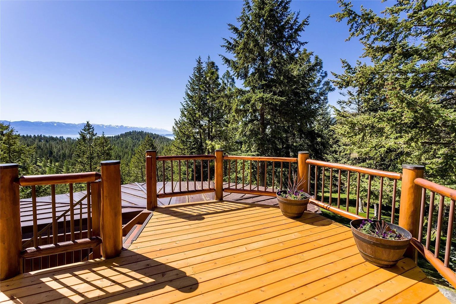 Expansive balcony with mountain and forest views, ideal for outdoor events at The Ridge.