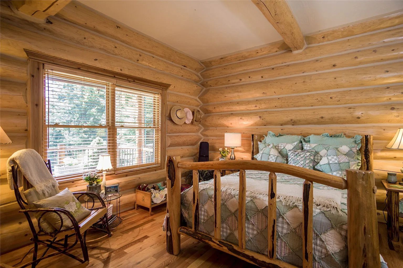 Lodge bedroom with king bed, luxurious lodging for guests at The Ridge at Flathead Lake.