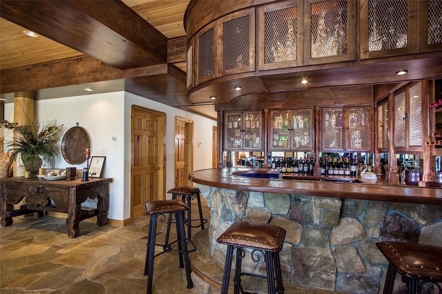 Rustic stone bar in downstairs lounge, perfect for entertaining guests at The Ridge vacation rental.