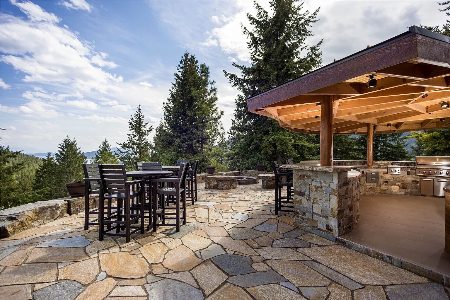 Outdoor bar and stone patio, perfect for wedding receptions at The Ridge, overlooking Flathead Lake.
