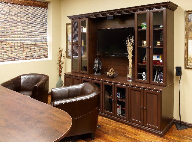 An office featuring custom closet cabinets designed by Closet Connection