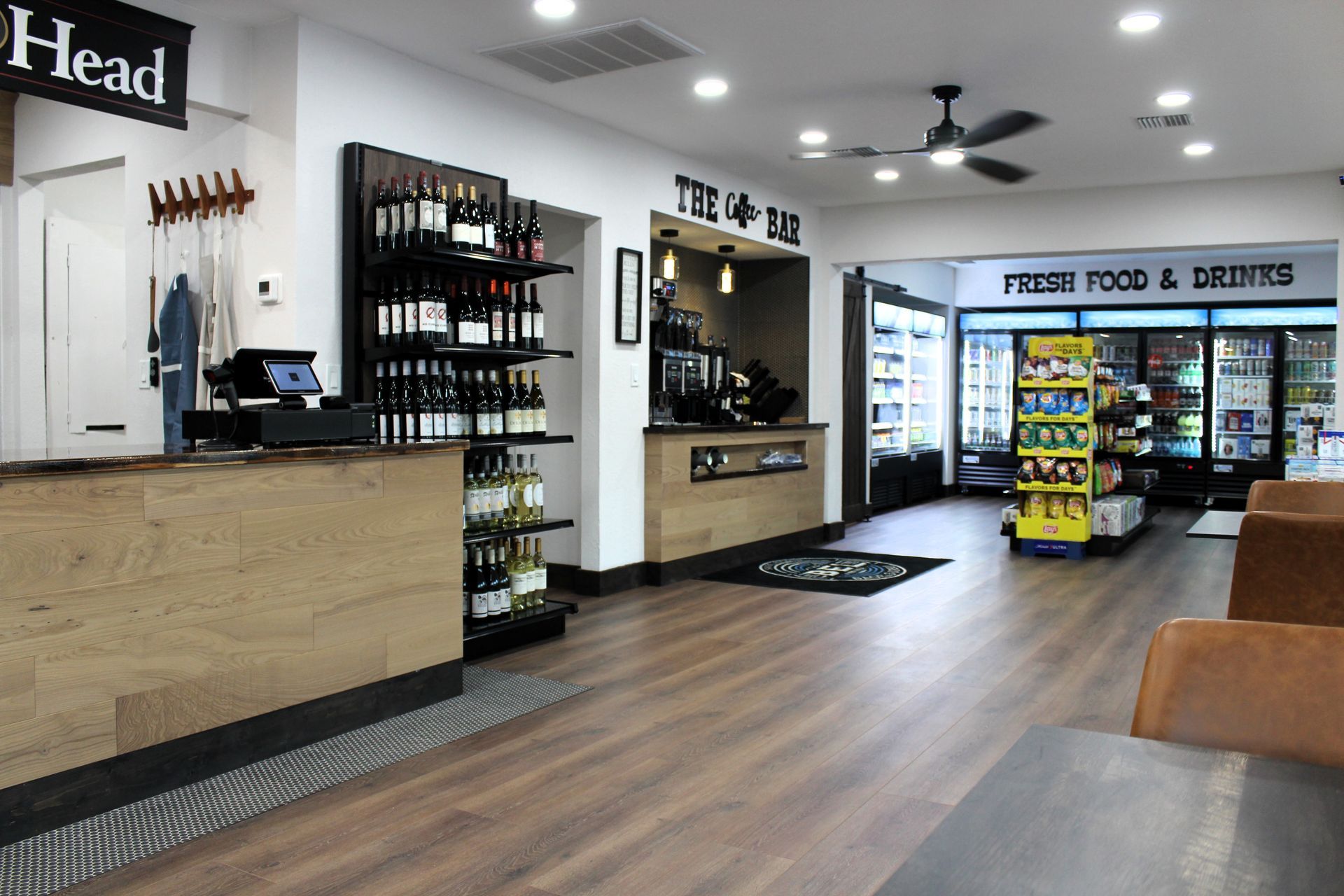 The inside of a restaurant with a sign that says ' head ' on it.