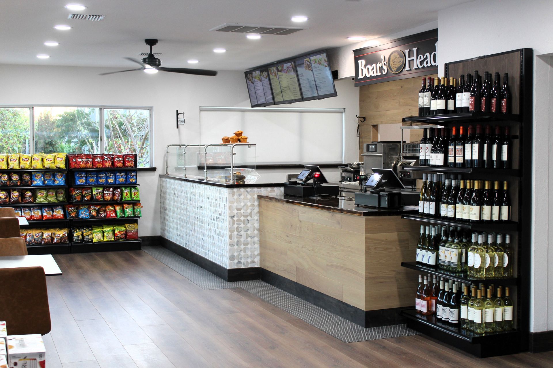 A store filled with lots of bottles of wine and snacks.