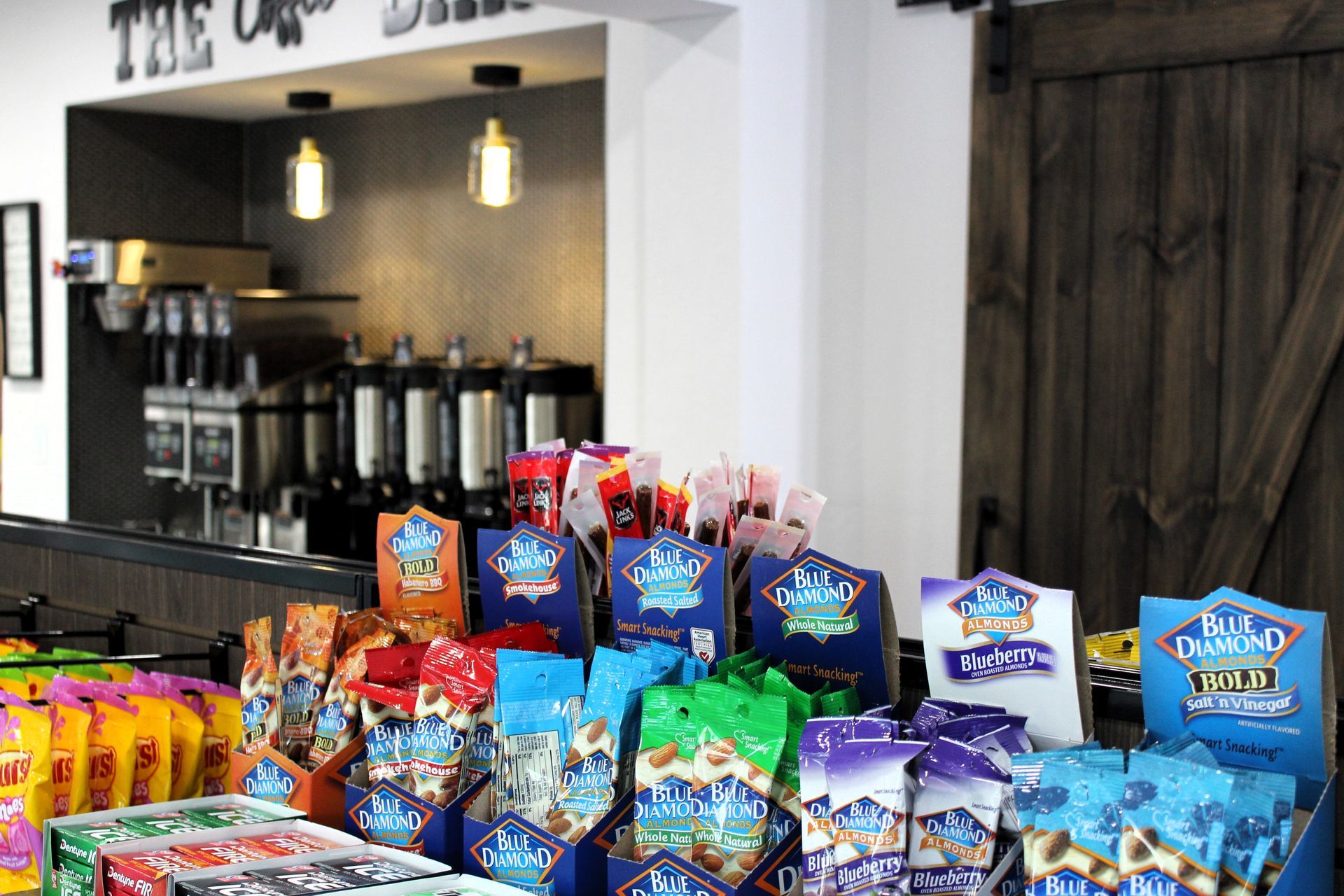 A variety of snacks are on display in a store.