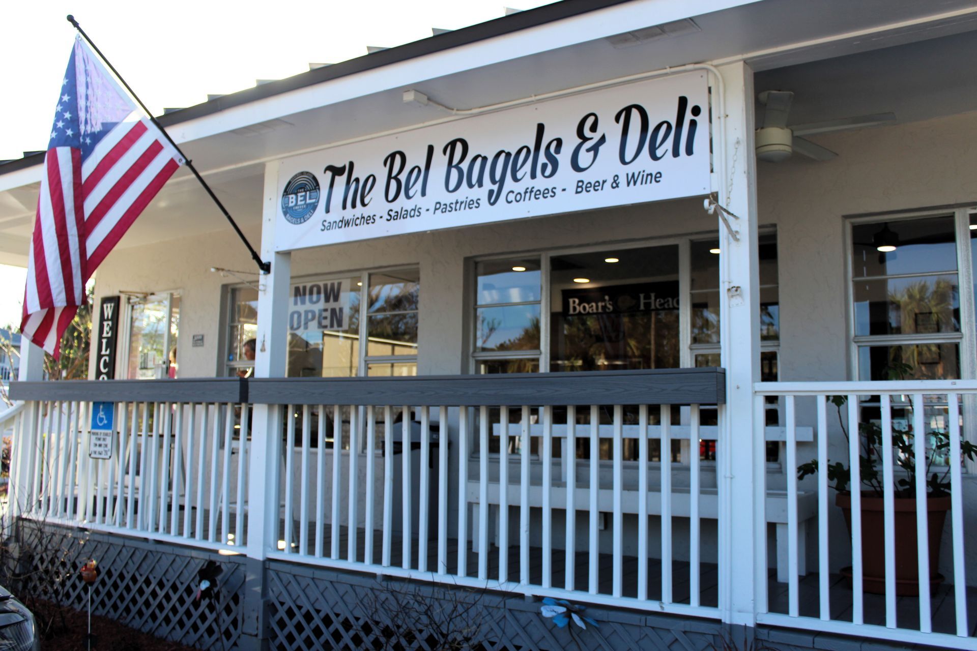 A store front with a sign that says the bell bagels & deli