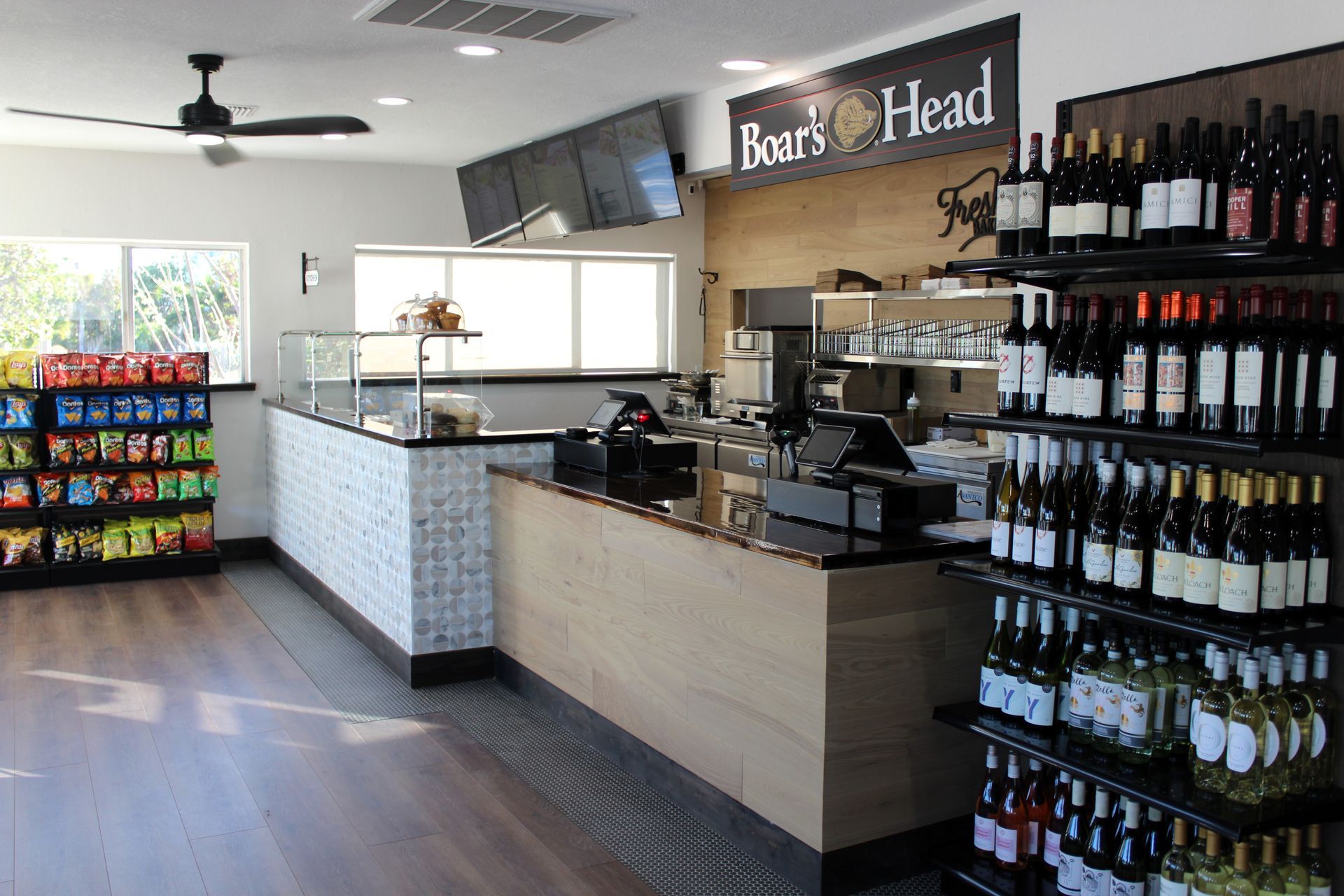 A store filled with lots of bottles of wine and snacks.