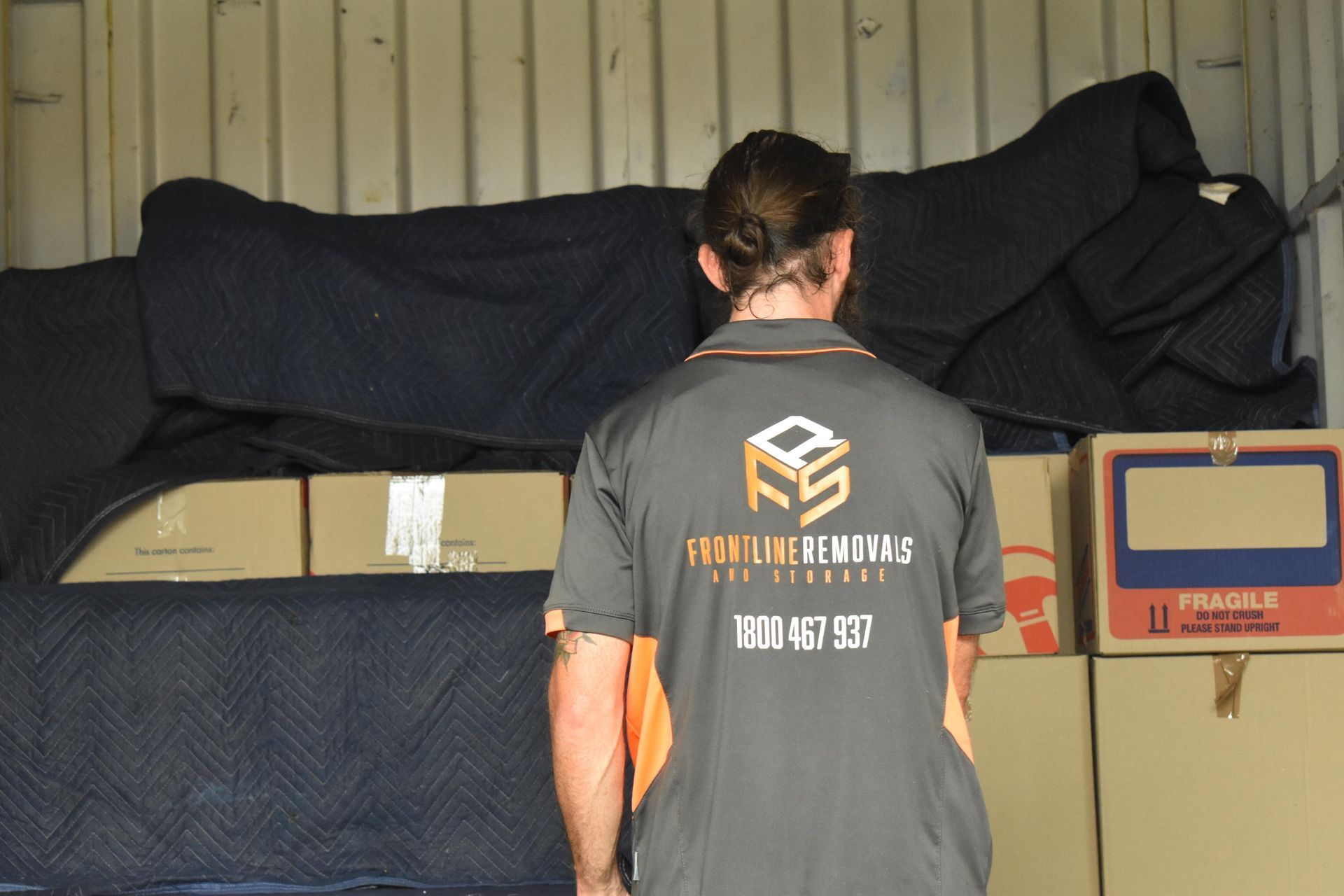 Man Wearing a Company Shirt — Frontline Removals And Storage in Port Macquarie, NSW