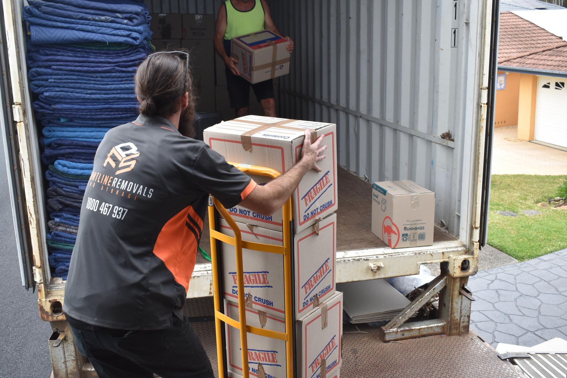 Movers Loading Boxes Into a Truck — Frontline Removals And Storage in Port Macquarie, NSW