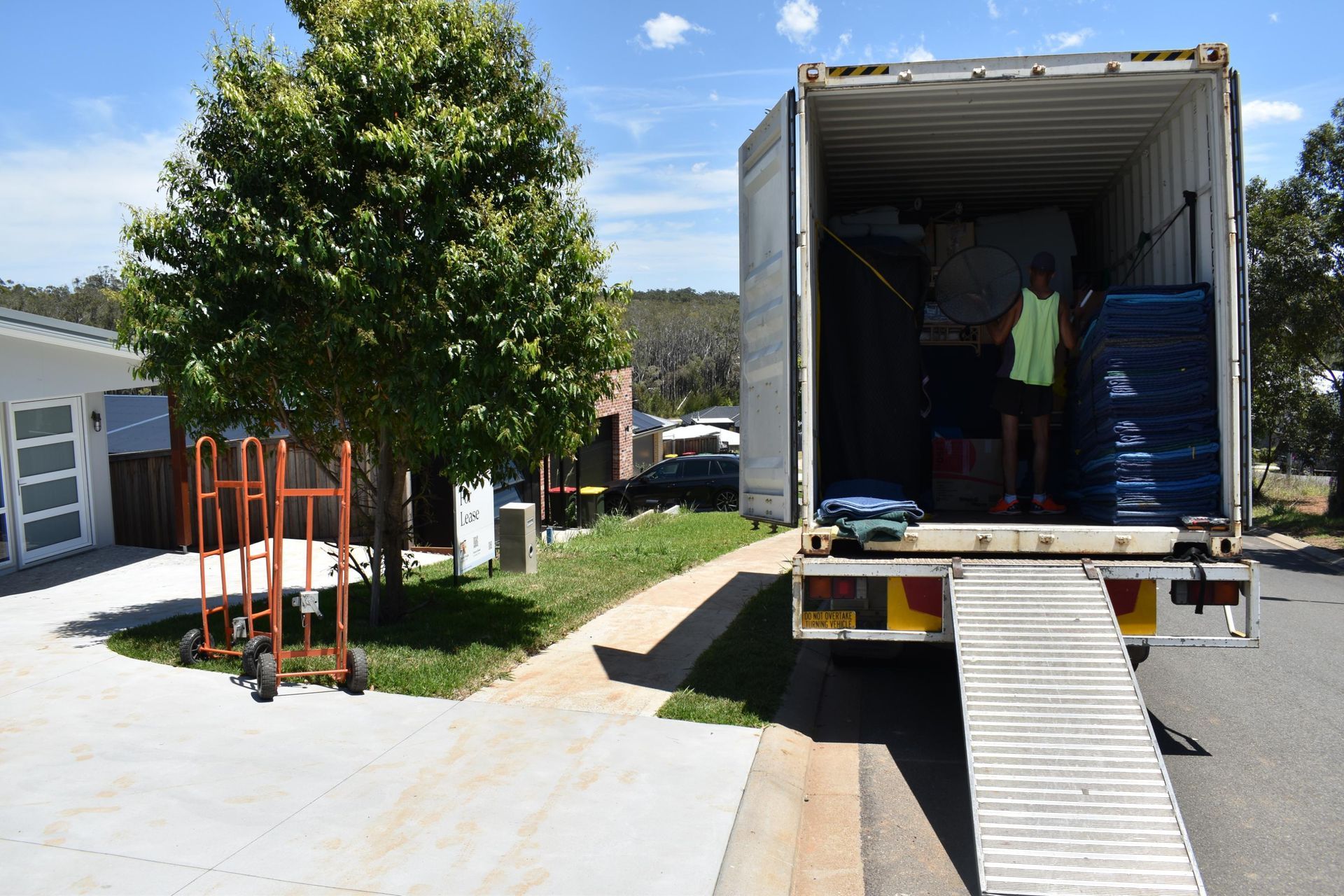 Movers Loading a Container Truck — Frontline Removals And Storage in Port Macquarie, NSW