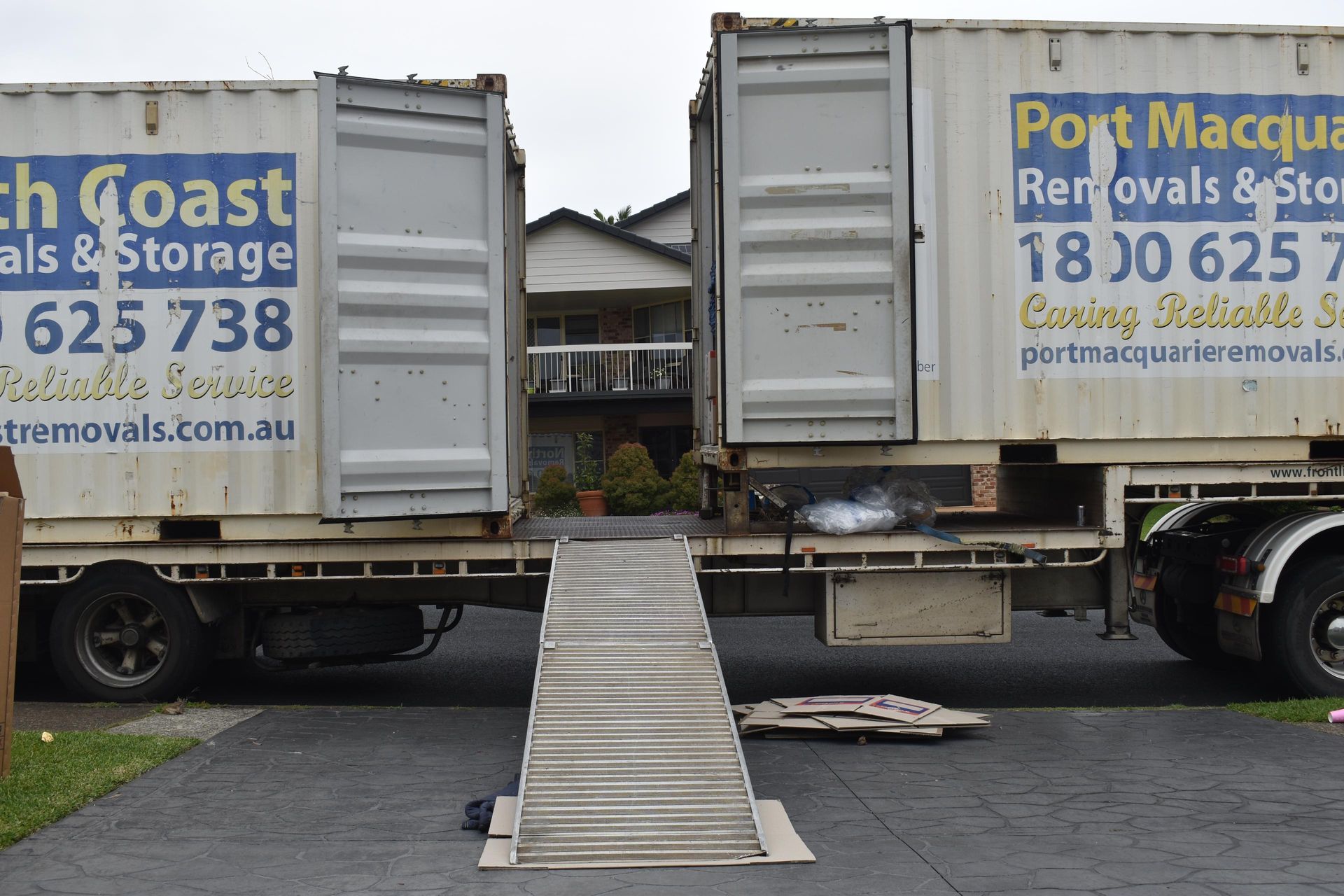 Two Moving Trucks With Ramps — Frontline Removals And Storage in Port Macquarie, NSW