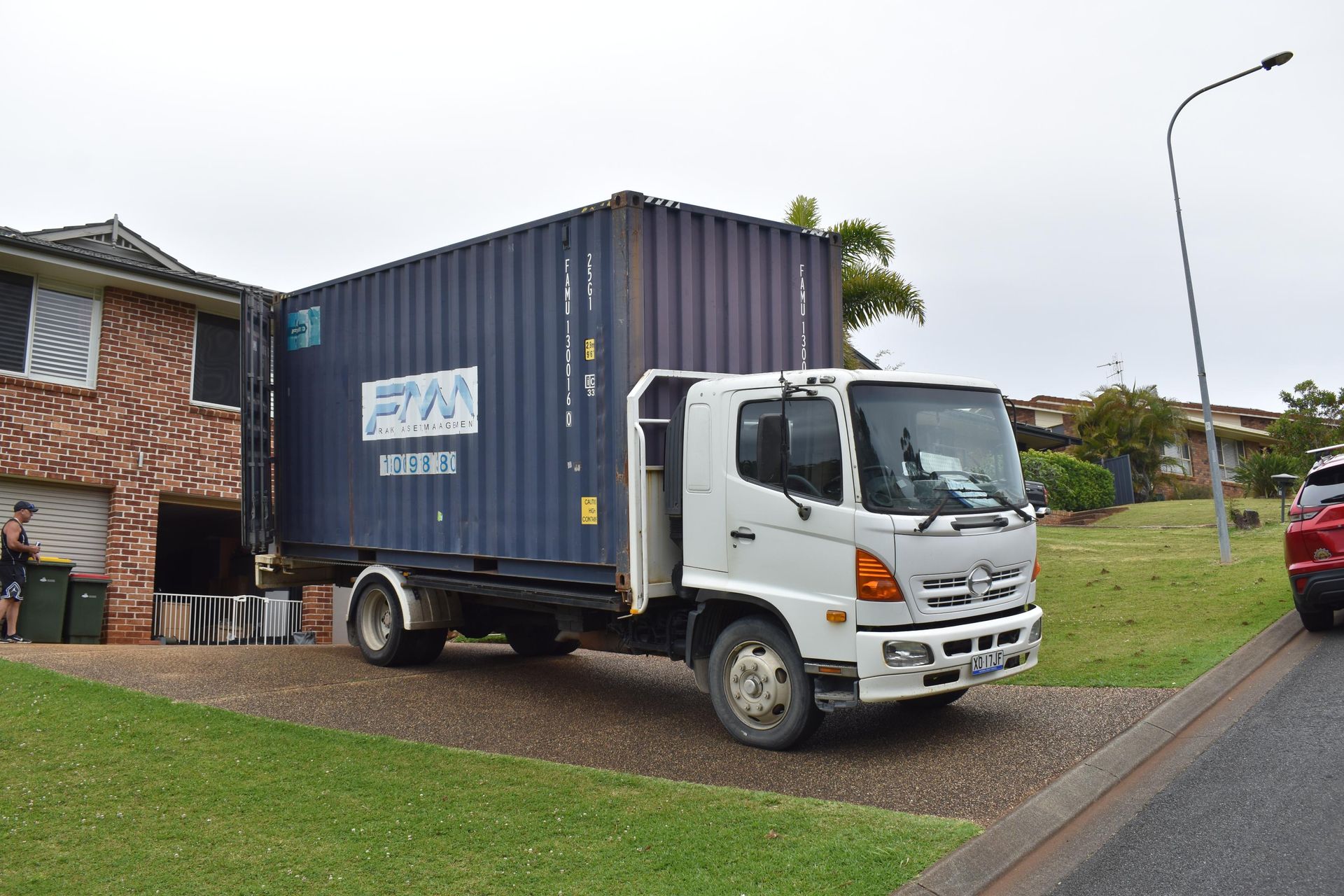 Blue Shipping Container on a White Truck — Frontline Removals And Storage in Port Macquarie, NSW