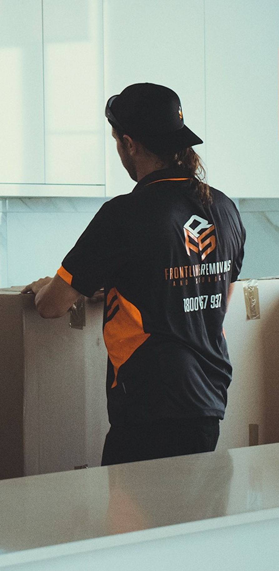 Moving Boxes Are Stacked On Top Of Each Other In An Empty Room — Frontline Removals And Storage in Tamworth, NSW