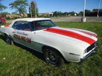 White 1969 Chevrolet Camaro convertible with red racing stripes, 