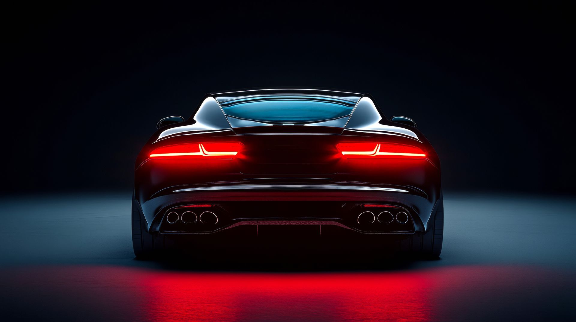 The back of a black sports car with red lights on in a dark room.