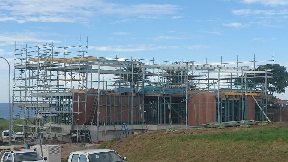 A White Van is Parked in Front of a Building Under Construction — Burke Metal Fabrication In Taree, NSW