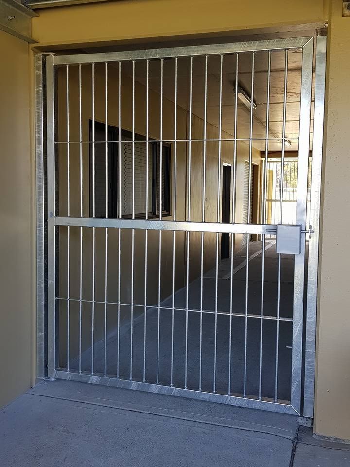 A Stainless Steel Gate is Open to a Building — Burke Metal Fabrication In Taree, NSW