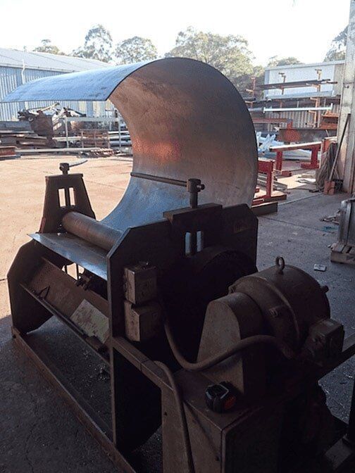 A Person is Measuring a Piece of Metal With a Caliper — Burke Metal Fabrication In Taree, NSW