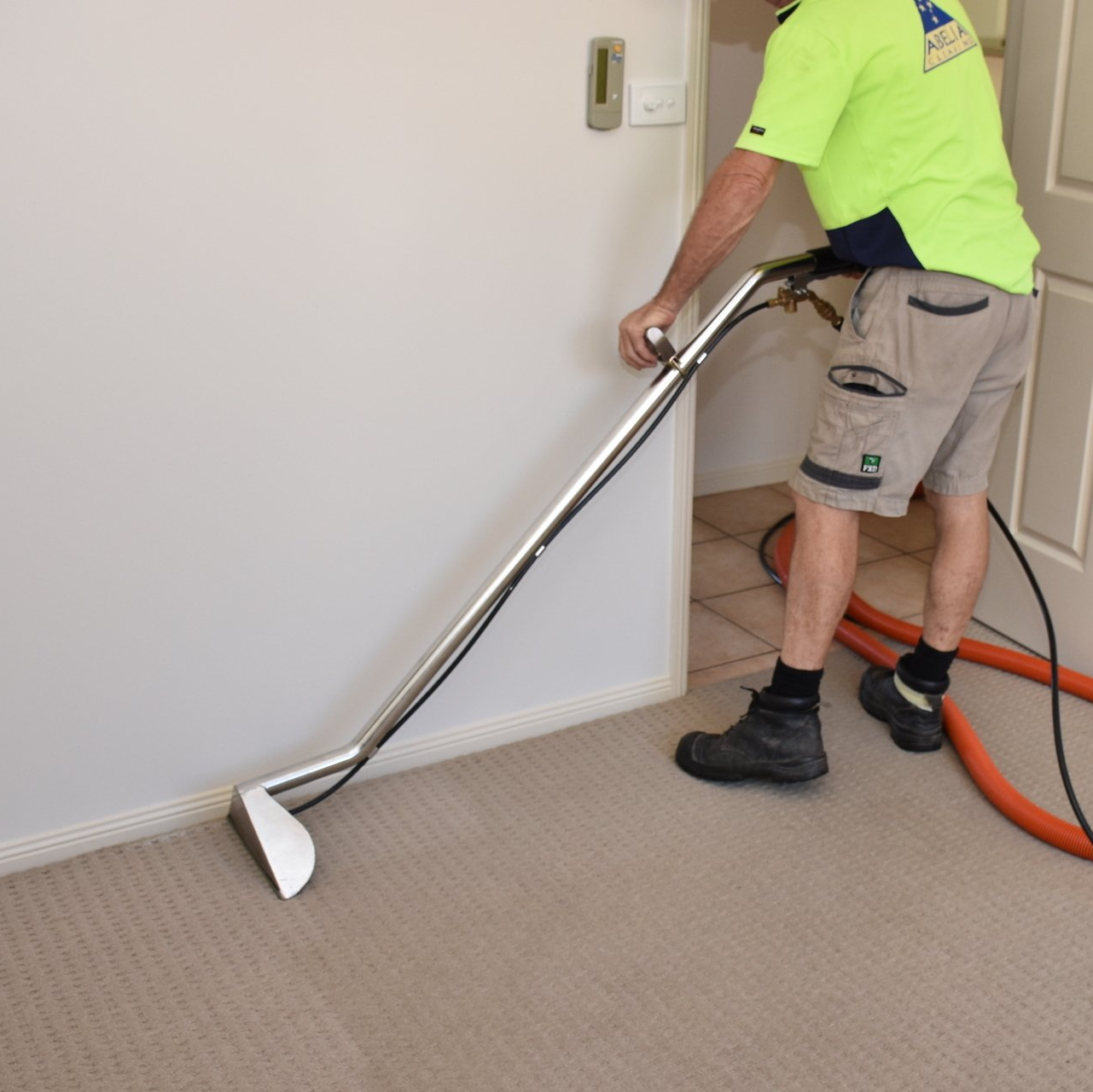 Man Cleaning Steam Carpet At Office — Cairns, QLD — Abelia Cleaning
