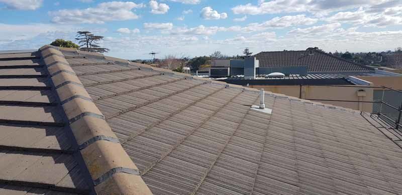 restored roof on house in neighborhood
