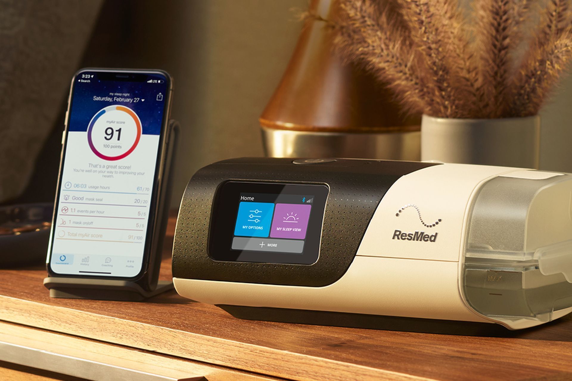 A cell phone is sitting next to a machine on a desk. — Mid North Coast Sleep Clinic in Taree, NSW