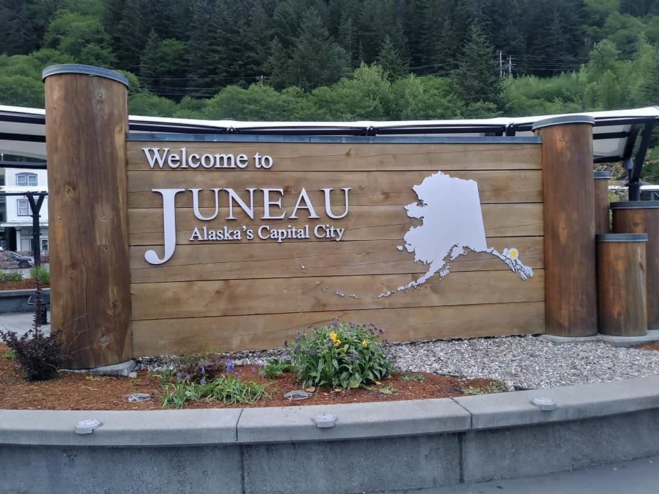 A wooden sign reads