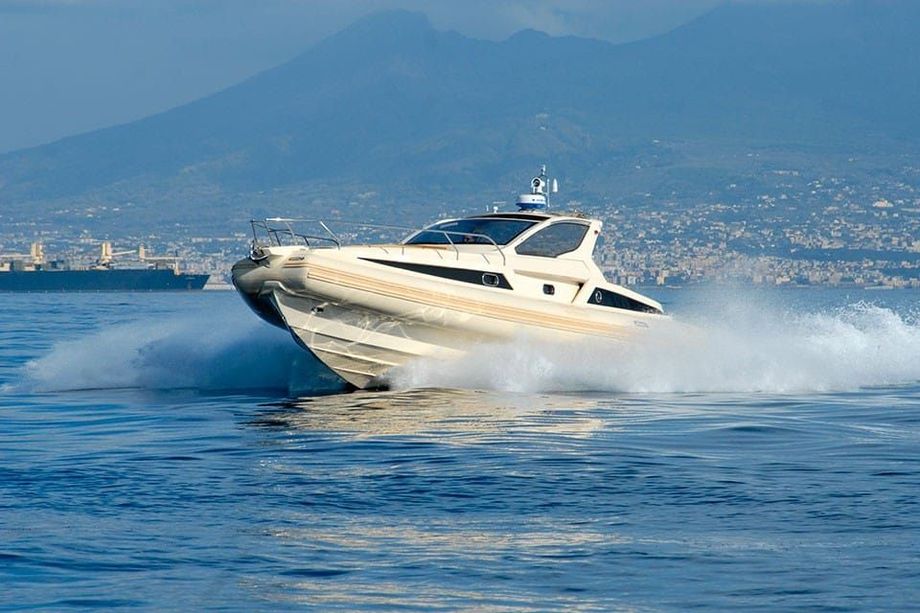 A boat is floating on top of a body of water.