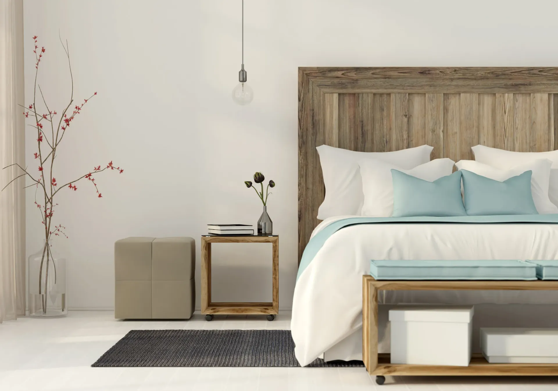 Bedroom with a rustic wooden headboard, white bedding, light blue pillows, and a small bedside table.