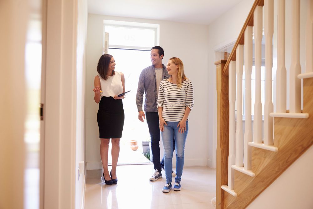 Tenants looking at a home with a property manager