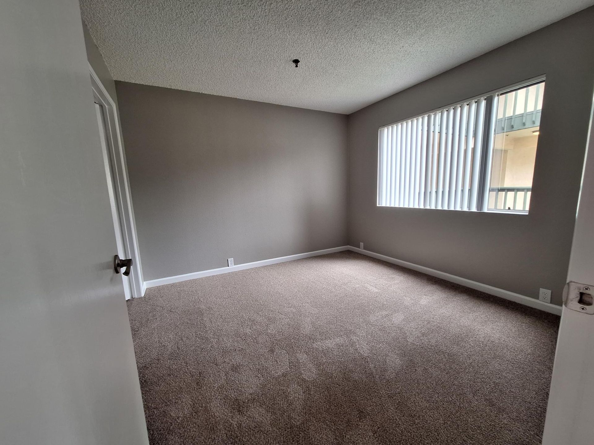 There is a large window in the middle of the room.