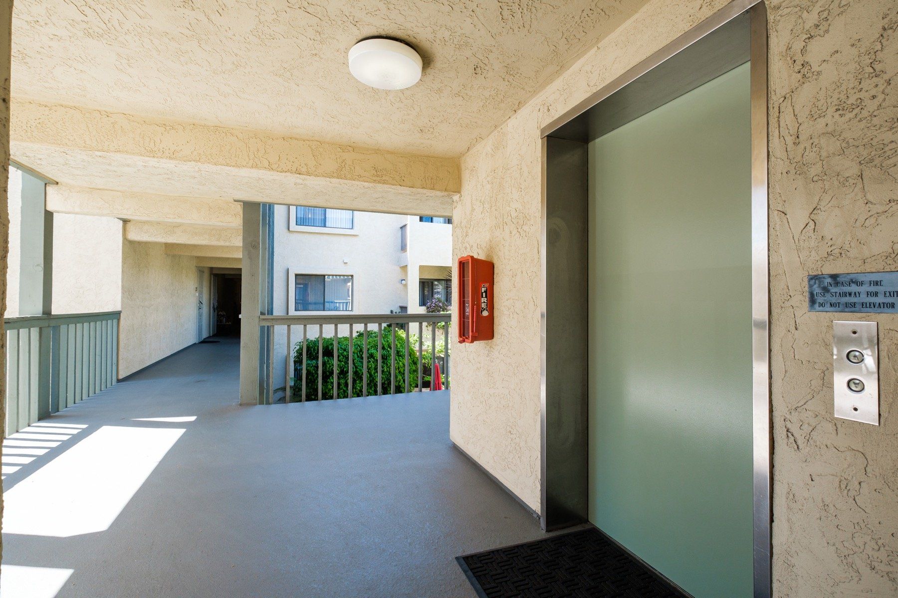 A building with an elevator and a fire extinguisher