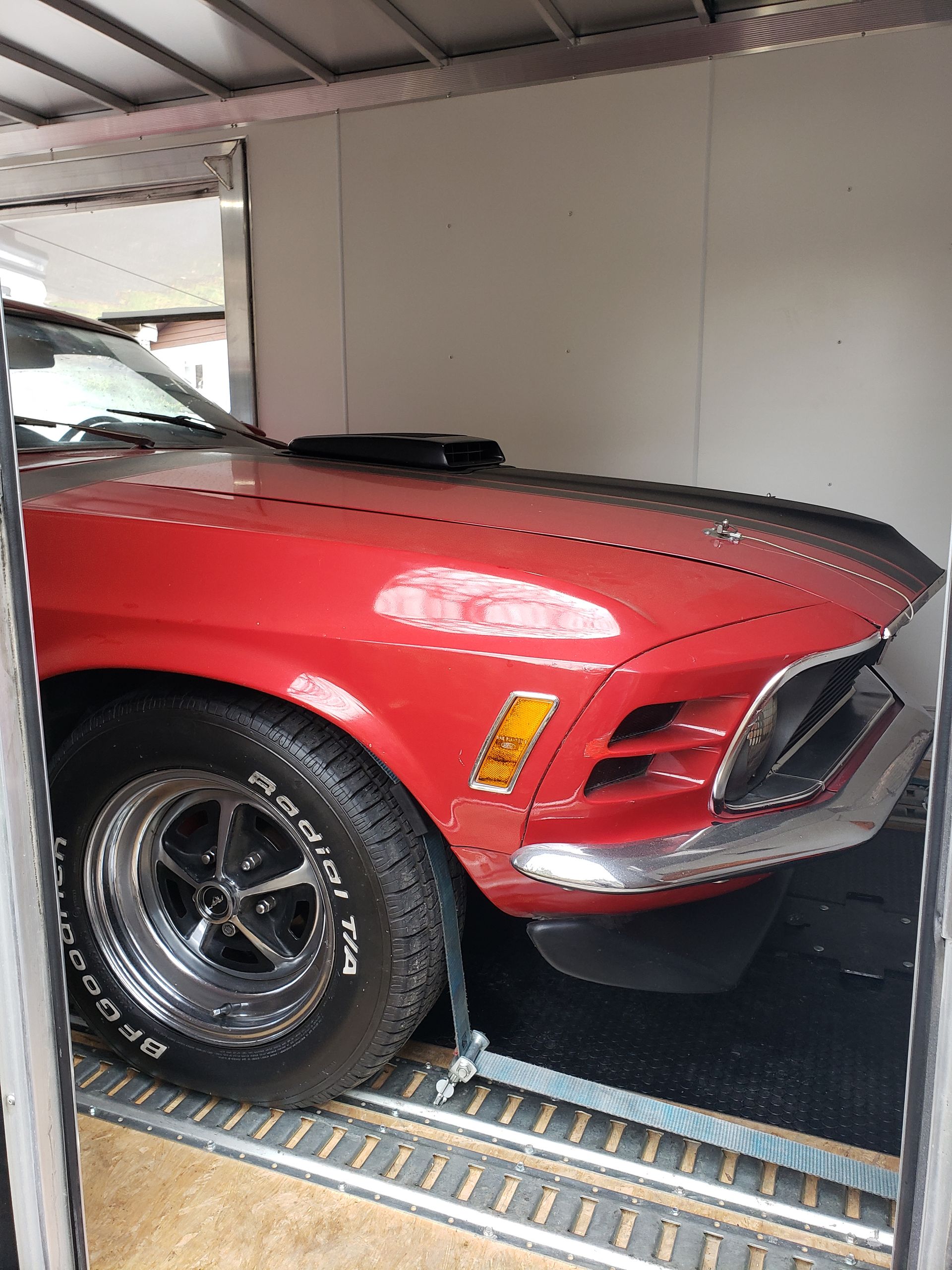 A red car with a bfgoodrich tire on it