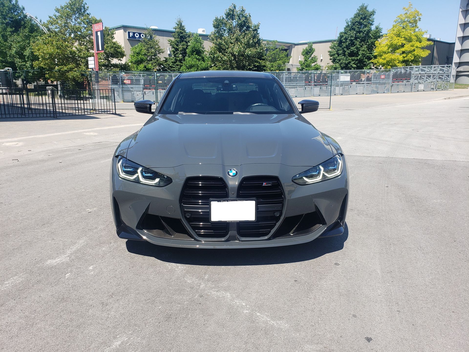 A bmw m3 is parked in a parking lot