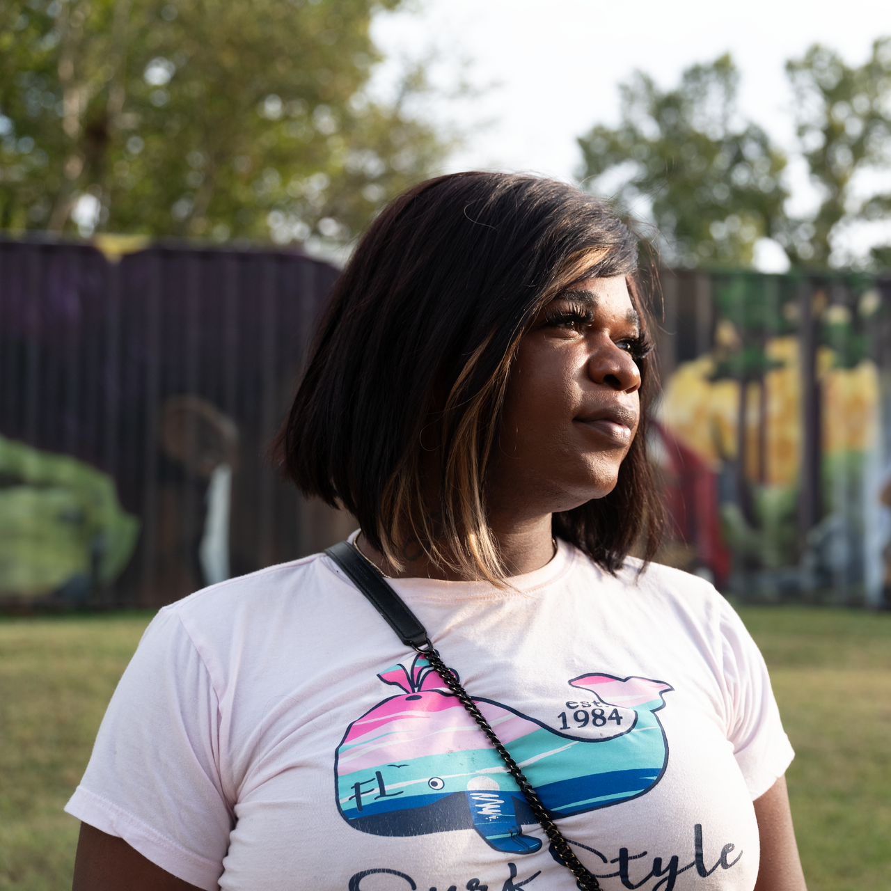 a close up of a woman 's face with a blue background