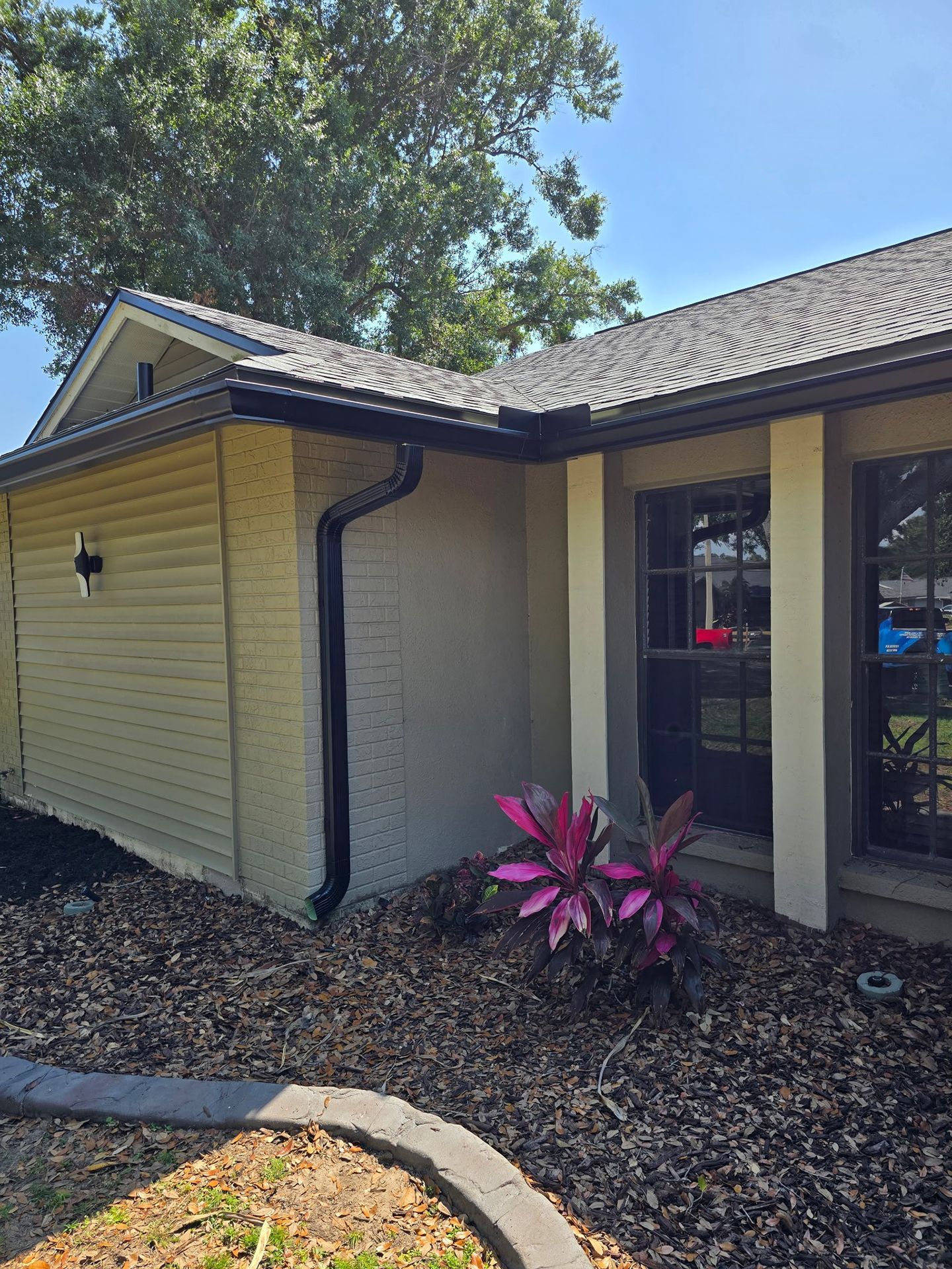 black gutter and downspout