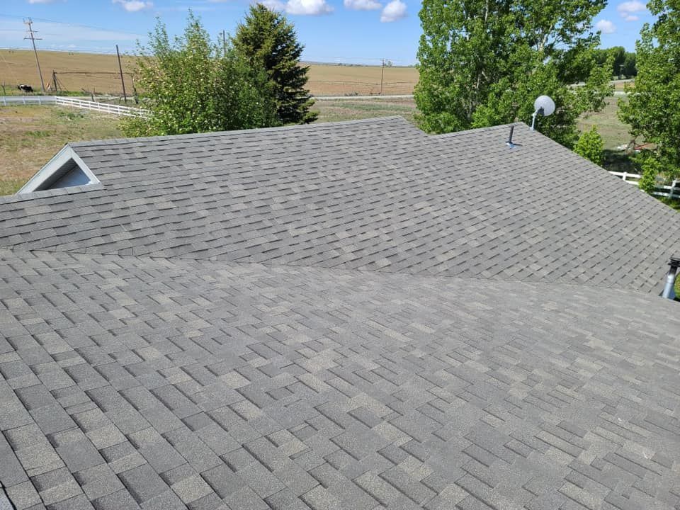 The roof of a house with a satellite dish on it