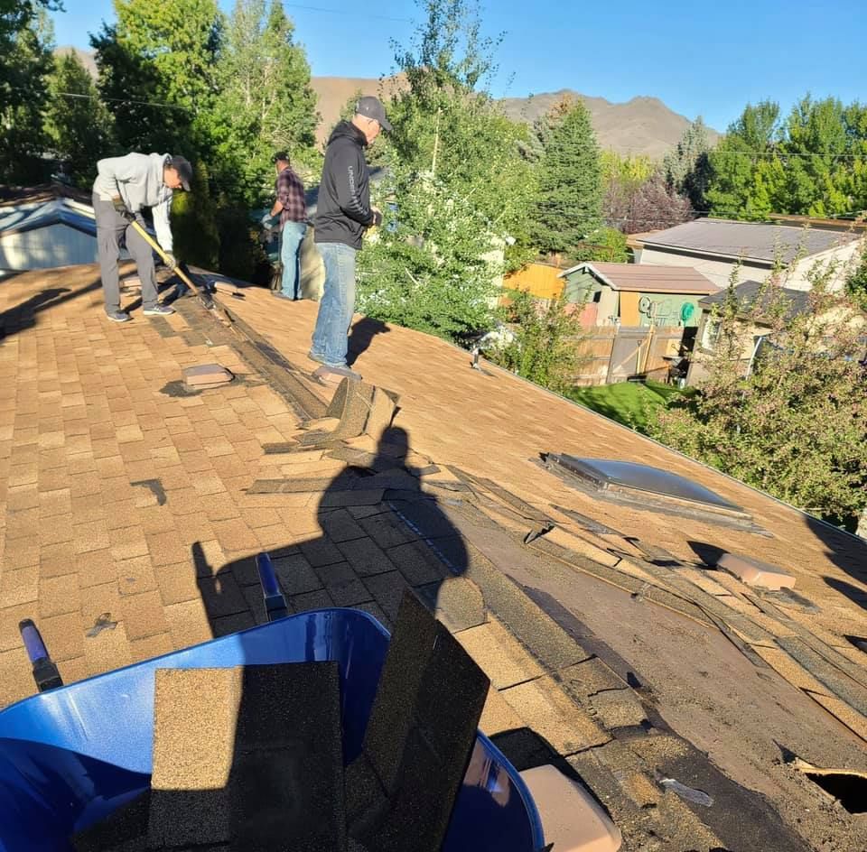 A group of people are working on a roof
