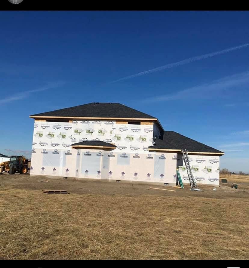 A large house is being built in a field