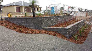 retaining wall; landscaping; block wall; grass tree; black boy; garden; tiered retaining wall