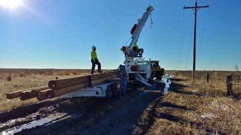 Offloading Poles — Pueblo, CO —  Main Electric