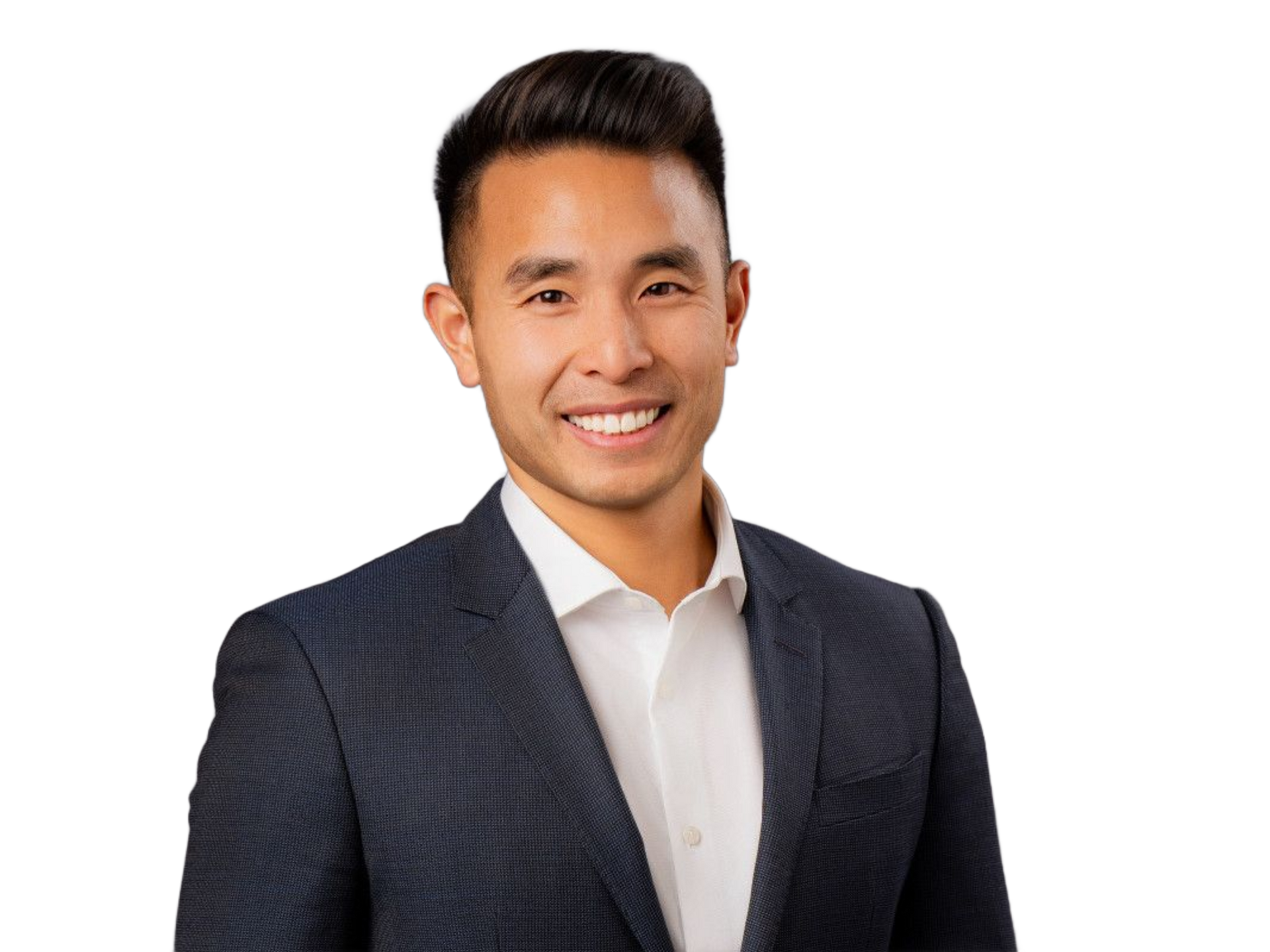 On-site Headshot Photographer Smiling man in a dark blazer and white shirt against a white background.