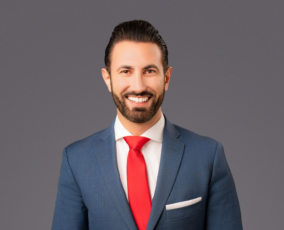 A black and white photo of a woman with curly hair