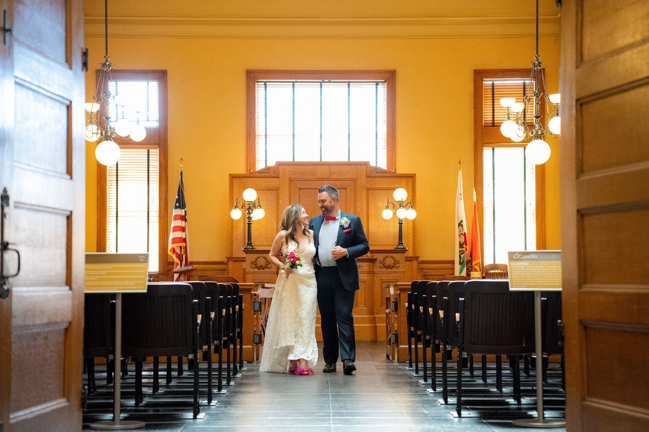 Historic Courtroom Wedding A bride and groom are standing in the historic courtroom in the Old Orange County Courthouse.